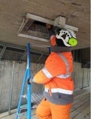 An MRS Training &amp; Rescue team member accessing a confined space in a bridge