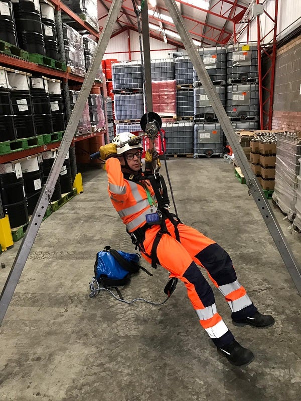 MRS team member demonstrating the use of a body harness and tripod support as part of World Safety Day.