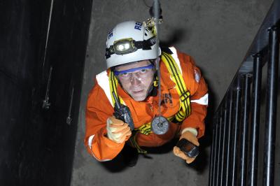 A person using a sensor in a low risk confined space 