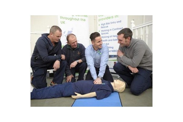An MRSL trainer shows a class how to conduct CPR during a first aid training course. 