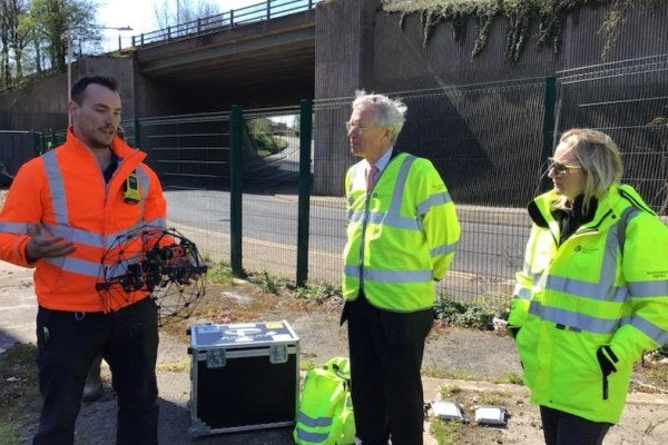 Drone pilot discussing the flight with the Environment Agency team