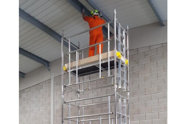 A person is using a mobile tower as part of the PASMA Towers for Users Training Course 