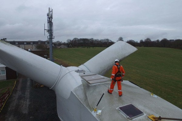 A person working on a wind turbine as part of their GWO Enhanced First Aid Training.