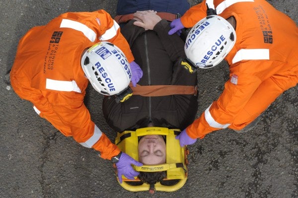 Two men completing rescue training using a stretcher 