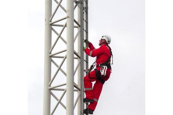 Someone is climbing a tower during the MATS Basic Tower Climbing & Rescue Course