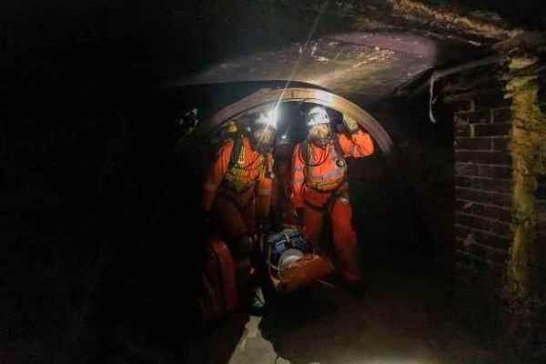 Rescue team bringing casualty safely out of the confined space