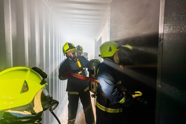 Delegates inside the specialist STCW fire training rig