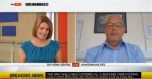 A screenshot of a news broadcaster and an MRS Training and Rescue manager during an interview